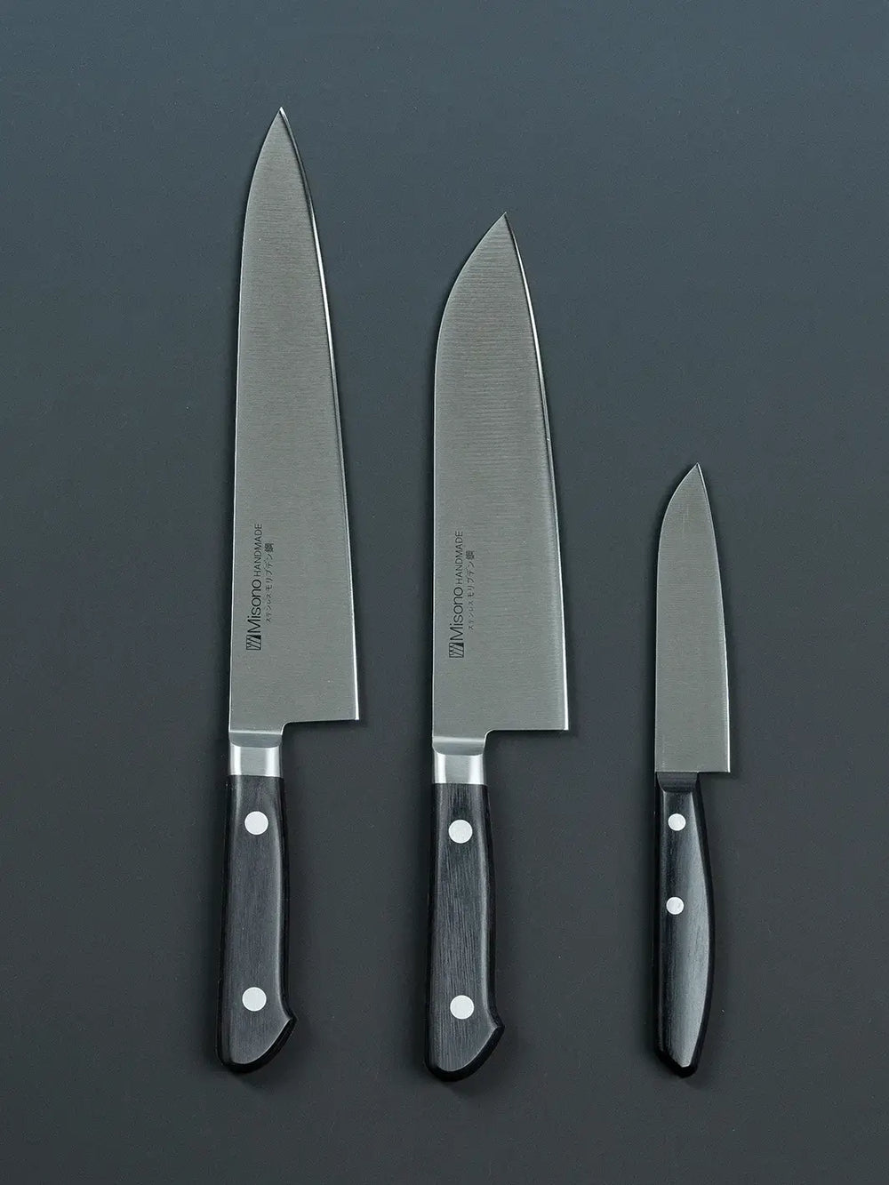 Front view of the Misono gyuto, santoku, and petty knives, highlighting the blade design and brand logo.
