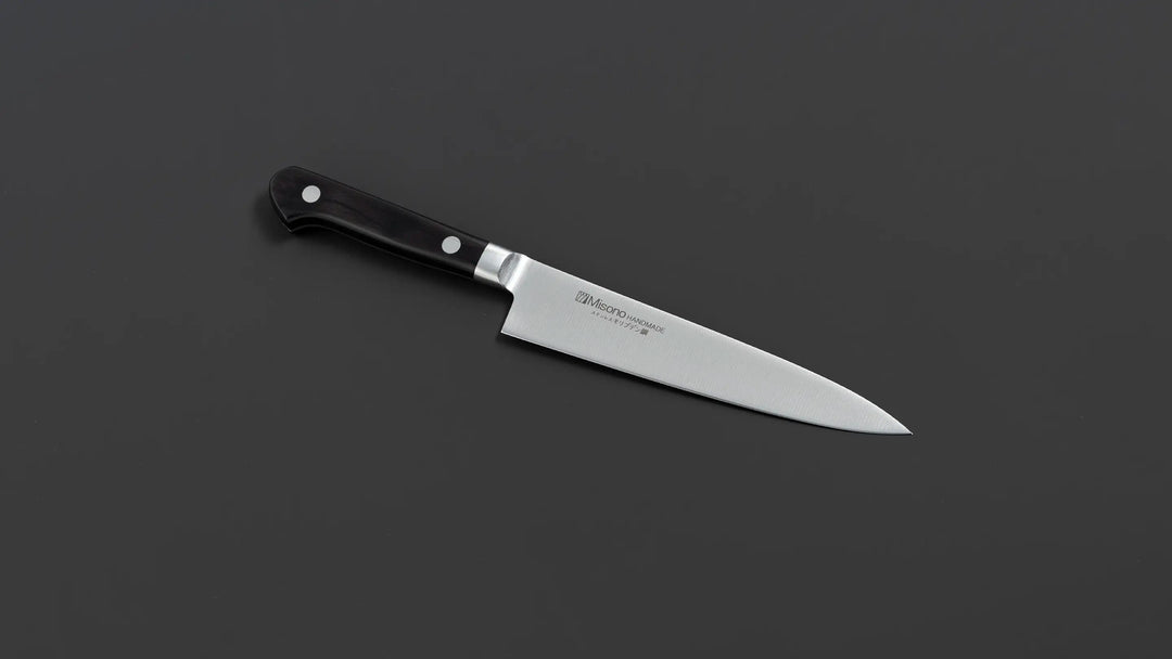 Petty Knife for Precision Cutting, featuring ergonomic handle and sharp blade