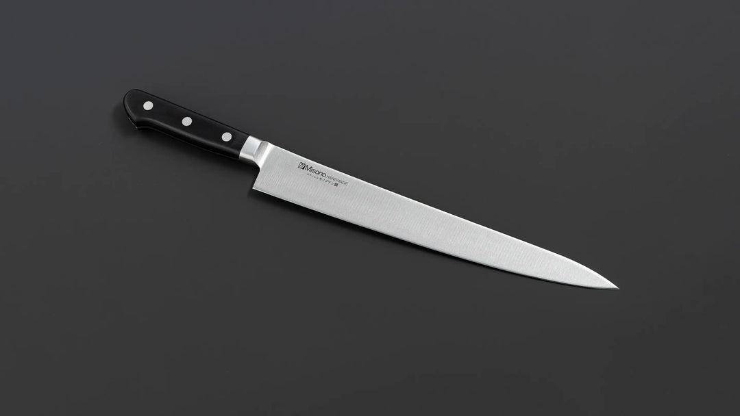 Precision Japanese Sujihiki Chef's Knife for Effortless Slicing, featuring a long, slender blade ideal for cutting meat and fish.
