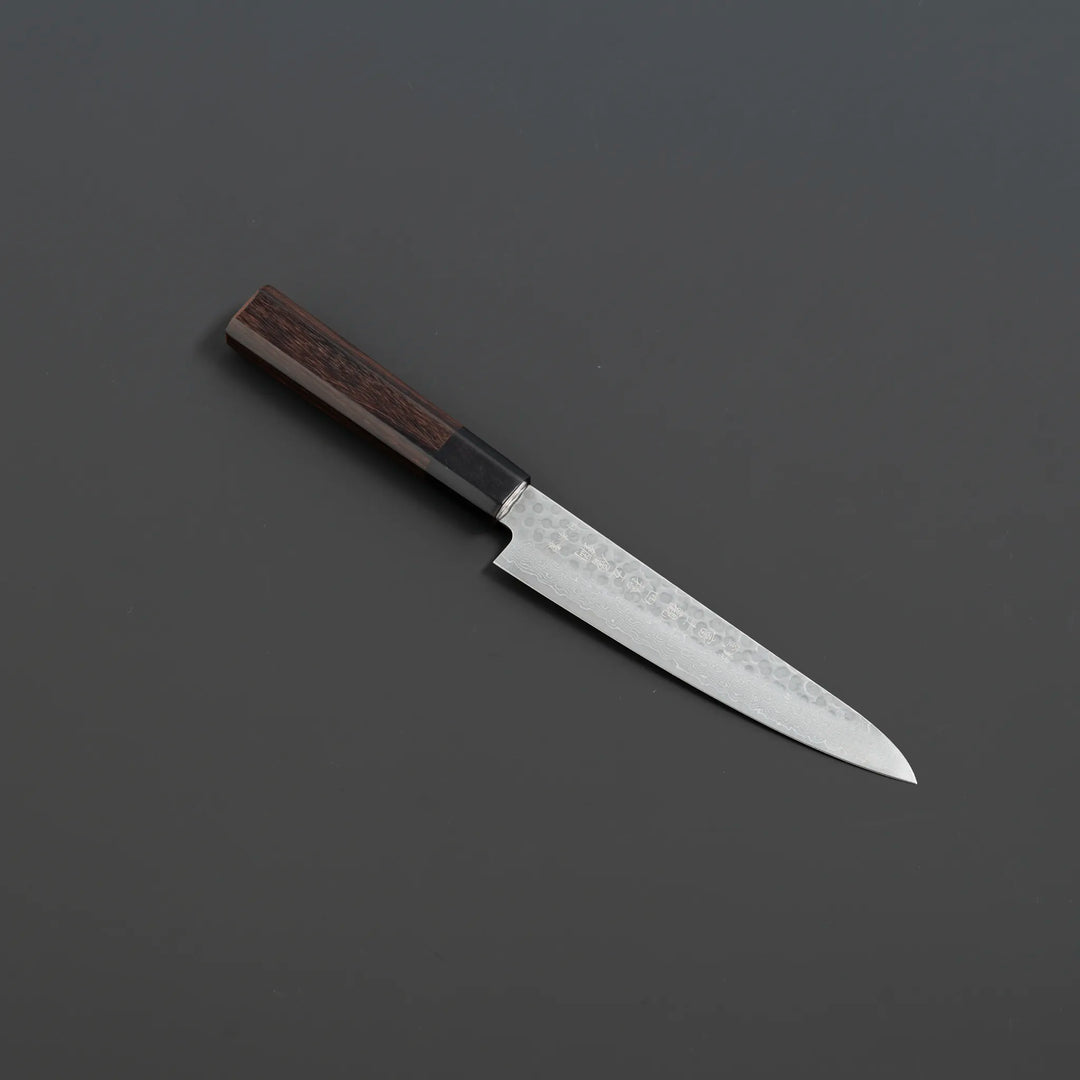 Fujikan Aus-10 Damascus Steel Gyuto Knife with ergonomic handle and razor-sharp edge for professional chefs