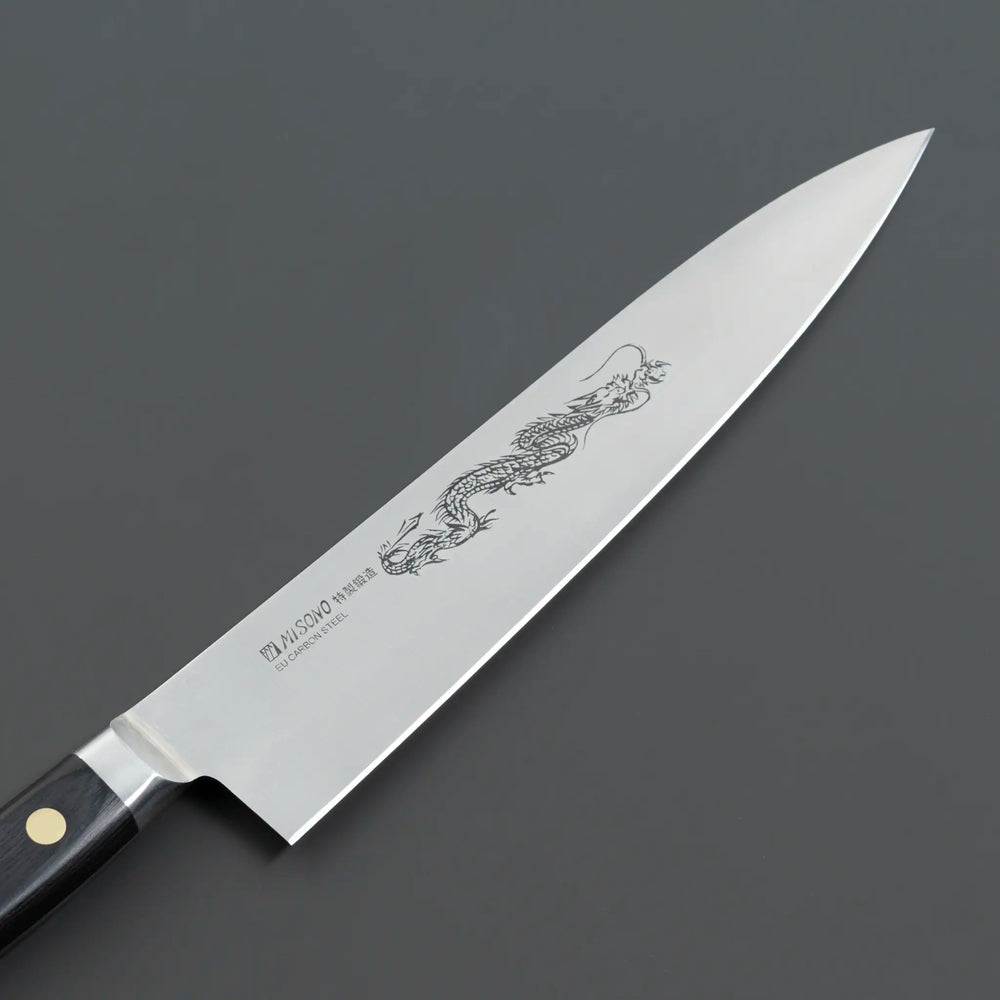 Misono Swedish Carbon Steel Gyuto Knife with intricate dragon engraving on the blade, offering precision cutting