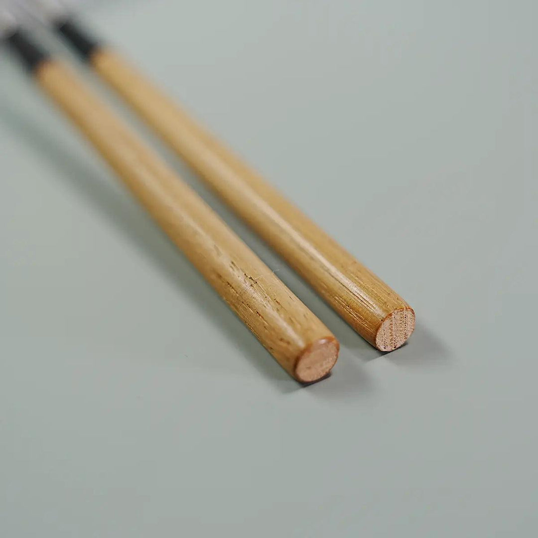 Detail of the chestnut wood handle on Sakagen Titanium Moribashi Chopsticks