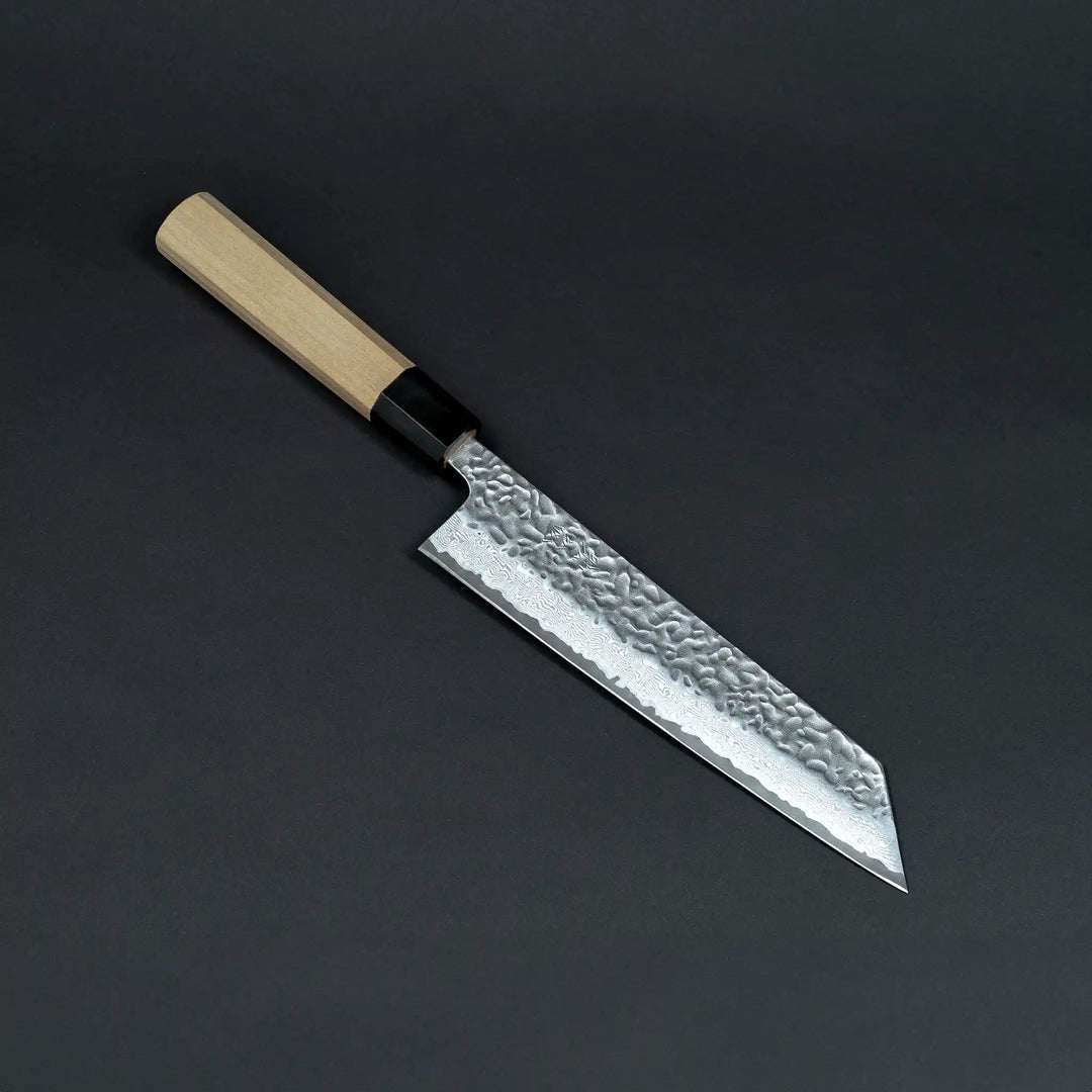 Close-up view of the Sukematsu AUS10 Tsuchime Hammered Gyuto knife blade