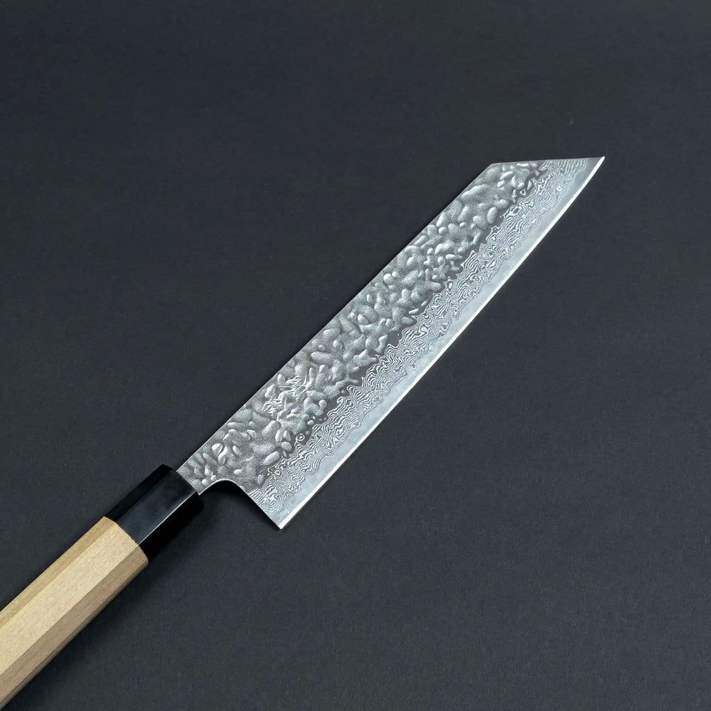Close-up view of the Sukematsu AUS10 Tsuchime Hammered Gyuto knife blade